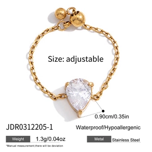 Macro shot of adjustable gold chain ring with 0.90cm teardrop zircon and slider bead