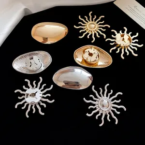 Four-piece metal sunflower brooch and cufflink set in gold and silver finishes