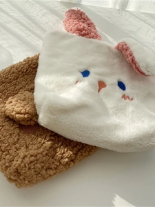 Cute plush bunny storage bag with embroidered face and soft faux fur texture