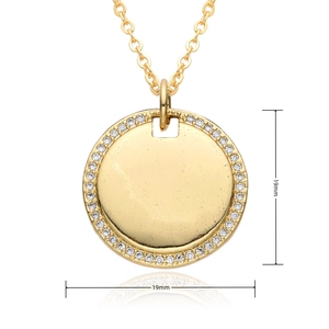 Detailed view of a 19mm gold round pendant necklace featuring micro-set zircon crystals