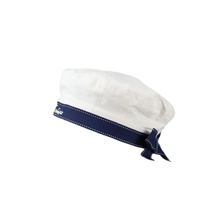 Japanese style white navy beret with blue ribbon and bow on a white background