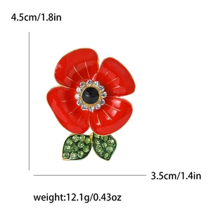 Red enamel poppy flower brooch with crystals and size markings in professional studio shot