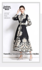 Detail of vintage paisley pattern on a high waist long sleeve button-down dress with belt