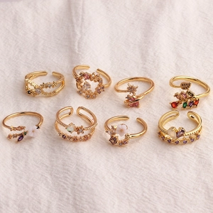 Adjustable gold flower rings set with colorful zircon and heart-shaped details