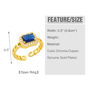 Macro-opname van blauwe zirkonia ring met vergulde Cubaanse schakelband en opening