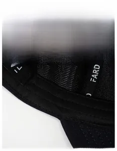 Detail of moisture-wicking sweatband and precision stitching inside the black baseball cap