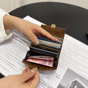 Brown vintage leather accordion card holder for women with multi-slot design and metal snap