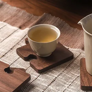 Japanese style black walnut wooden coaster with puzzle design and natural wood grain