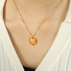 Chic 18K gold plated necklace with hands hugging heart pendant on elegant bead chain