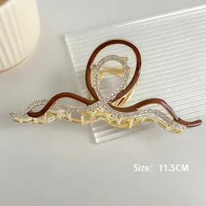 Pince à cheveux ondulée en métal doré avec émail brun rouge, taille de 11,5 cm de long