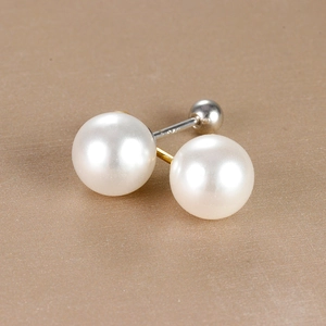 Close-up of S925 engraved stamp on 18K plated double pearl stud earrings with smooth finish