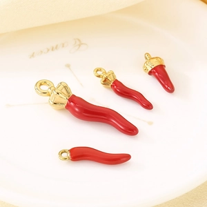 Polished red chili pepper pendants in various sizes with gold-plated caps and loops