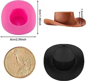 Pink silicone mold for mini cowboy hats with scale coin and size measurements