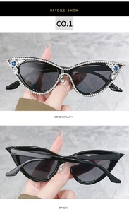 Detail of cat-eye sunglasses featuring white rhinestones and a blue gemstone accent