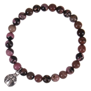 Detail of pink zebra jasper beads and silver ladybug charm on 6mm elastic bracelet