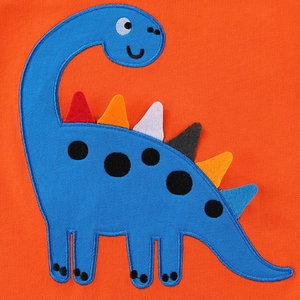 Boy's orange knit t-shirt featuring a blue dinosaur applique with colorful felt spikes