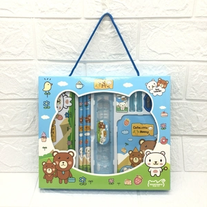Detail view of a blue stationery gift set with pencils, ruler, and cute cartoon notebooks