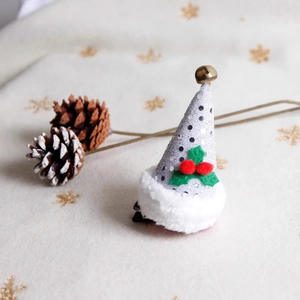 Christmas hat hair clip with silver sequins, white fur trim and golden bell detail