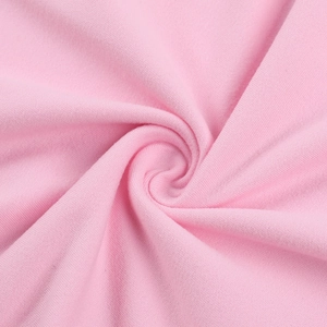 Detail shot of soft pink knitted fabric texture showing high-quality fiber weave and softness