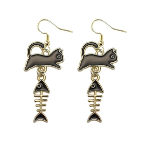 Asymmetric black cat and fish bone drop earrings with gold hooks on white background