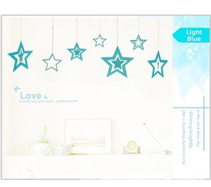 Set of decorative light blue hollow stars with glitter finish for wall hanging