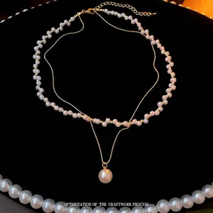 Double-layer vintage pearl necklace with golden chain and large pendant for women