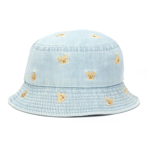 Close-up of light blue denim bucket hat featuring detailed cute bear embroidery patterns