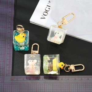 Creative 3D resin duck and bear charm keychain with colorful glitter and gold hook
