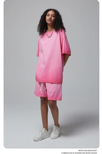 Full view of casual pink knit short set with dropped shoulder t-shirt and matching shorts