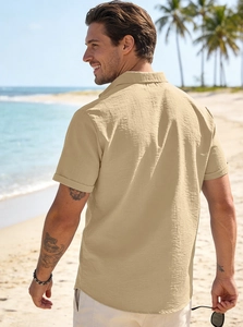 Detailed close-up of beige cotton linen shirt fabric texture and breathable weaving
