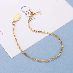 Golden paperclip chain necklace with Hamsa Hand pendant and toggle clasp closure