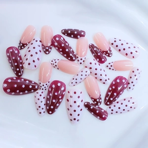 French almond press-on nails with burgundy and pink polka dot design in 24 pieces set