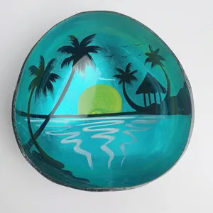 Macro detail of natural coconut shell bowl with hand-painted tropical island scene