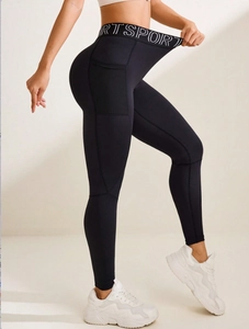 Women's black high-waisted yoga leggings with side pockets and Sport lettered waistband