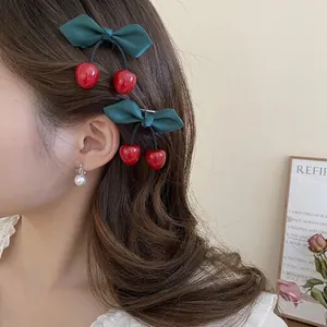 Fresh cherry hair clips with green satin bows and red resin pendants for women