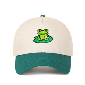Detailed embroidery of a green frog on lotus leaf on a two-tone trucker baseball cap