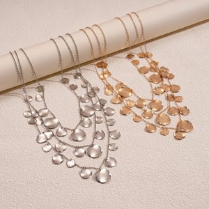 Three-layer metallic layered necklace with hammered round fringe pendants in gold and silver