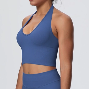 Close-up of blue halter neck sports bra showing ribbed texture and seamless fabric detail