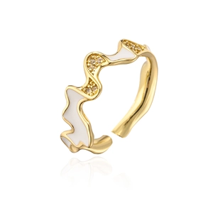 Detail of wave-shaped 18K gold plated ring with white enamel and sparkling zircon accents