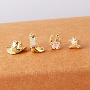 Detailed set of four gold cowboy studs including hat, boots, horseshoe, and star badge