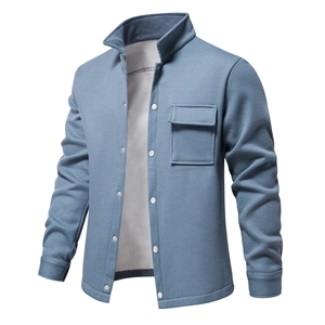 Detailed macro view of blue waffle knit fabric texture and chest pocket on men jacket