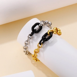 Retro titanium steel chain bracelet with irregular black resin link in gold and silver finish