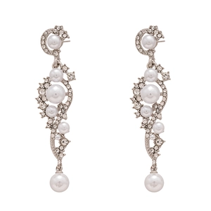 Elegant silver tassel earrings with white pearls and sparkling rhinestones on white background
