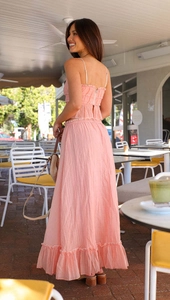 Detailed texture of pink pleated camisole and maxi skirt set for summer casual wear