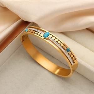 Vintage gold plated stainless steel hollow bangle with turquoise and zircons