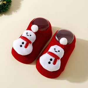 Detailed view of red Christmas baby floor socks with 3D plush snowman and knit texture