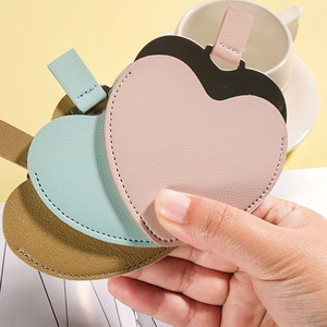 Irregular heart-shaped portable PU leather makeup mirrors in pink, green and khaki