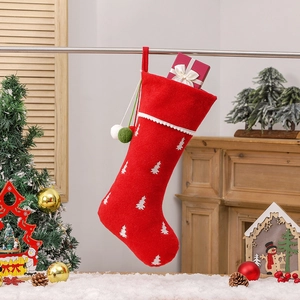 Red felt Christmas stocking with tree embroidery and festive gift box insert