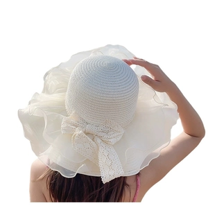 Creamy white wide-brim straw sun hat with lace bow and organza ruffles, back view