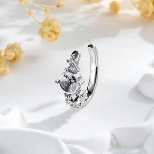 Luxurious silver stud earring setting with sparkling zircon stones on artistic white base